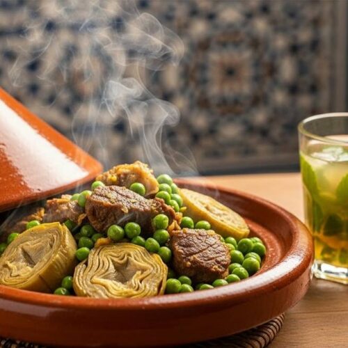 Moroccan meat peas and artichoke tagine cooking in a rustic clay pot with steaming fresh ingredients