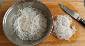 Softened vermicelli noodles chopped and ready for seafood bastilla filling.