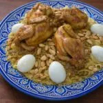 Typical Moroccan meal: Rfissa served with chicken, lentils, and eggs.