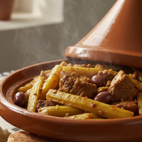 Traditional Moroccan cardoon recipe served in a clay tagine dish