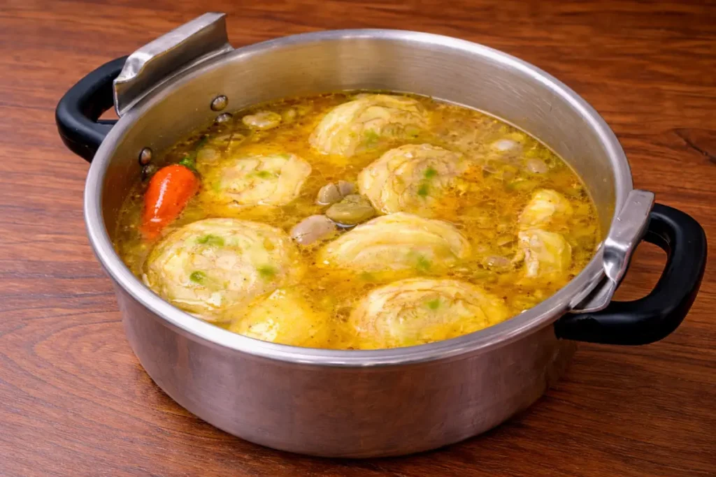 Warm water added to artichokes and fava beans in the pot for a Vegetarian Tagine Recipe